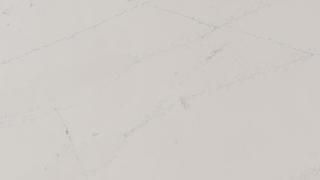 A close up of a white marble counter top.