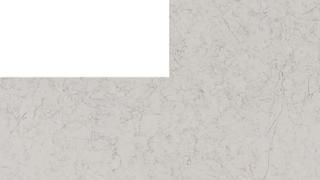 A close up of a white marble counter top with a white border.