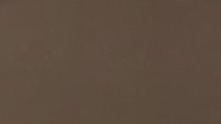 A close up of a brown paper texture.