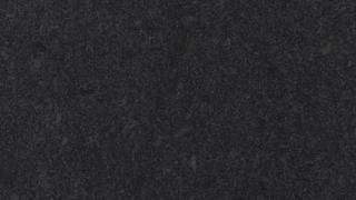 A close up of a black carpet texture.