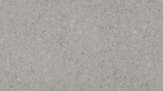 A close up of a gray carpet texture.