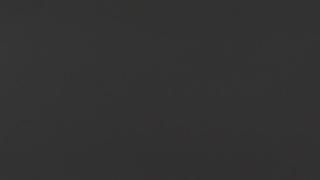 A close up of a black background with a plain texture.