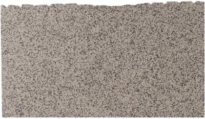 A close up of a piece of granite on a white background.