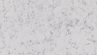 A close up of a white marble counter top.