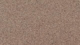 A close up of a brown carpet texture.