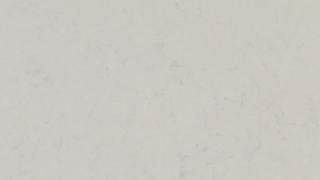 A close up of a white surface with a grainy texture.