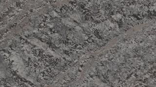 A close up of a gray granite counter top.