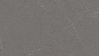 A close up of a gray tile with a marble texture.