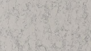 A close up of a white marble counter top.