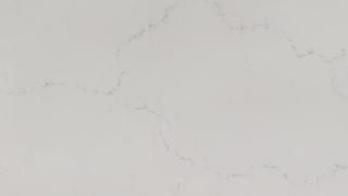 A close up of a white marble counter top.