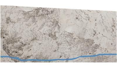A white granite slab with a blue line going through it.