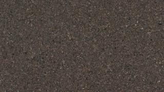 A close up of a concrete surface with a grainy texture.