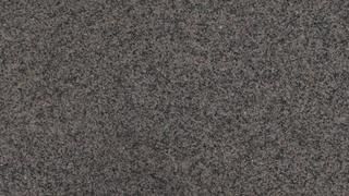 A close up of a gray carpet texture.