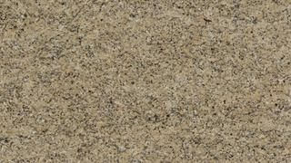 A close up of a brown granite counter top.