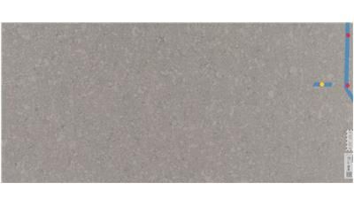 A close up of a gray tile on a white background.