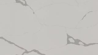 A close up of a white marble counter top with a gray marble texture.