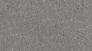 A close up of a gray surface with a grainy texture.