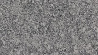 A close up of a gray granite counter top.