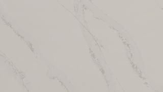 A close up of a white marble counter top.
