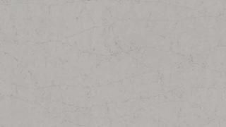 A close up of a white tile with a marble texture.