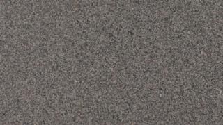 A close up of a gray carpet texture.