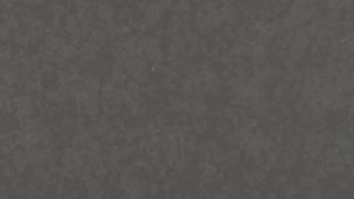 A close up of a gray paper texture.