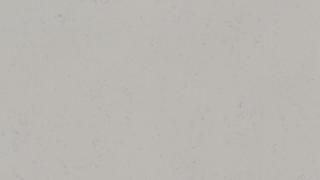 A close up of a white surface with a grainy texture.