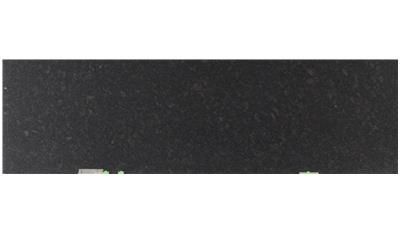 A close up of a black tile on a white background.