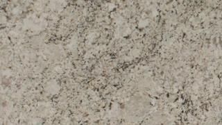 A close up of a white granite counter top.
