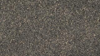 A close up of a gray carpet texture.