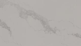 A close up of a white marble counter top.