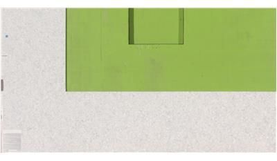 A green box is sitting on top of a white surface.