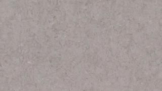 A close up of a gray paper texture.