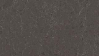 A close up of a gray granite counter top.