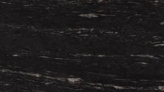 A close up of a black granite counter top.