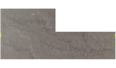 A piece of concrete with a yellow stripe on it is shown on a white background.