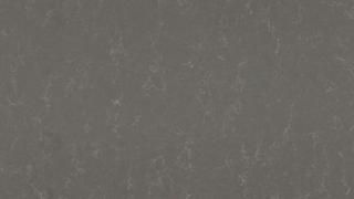 A close up of a gray surface with a grainy texture.
