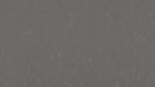 A close up of a gray surface with a grainy texture.