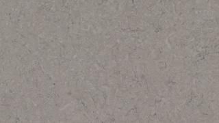 A close up of a gray carpet texture.