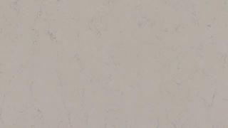 A close up of a white tile with a marble texture.