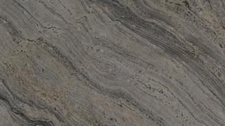 A close up of a marble counter top with a swirl pattern.
