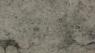 A close up of a gray granite counter top.