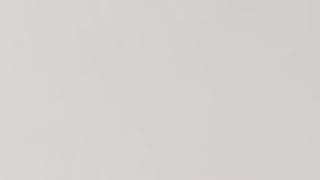 A close up of a white paper texture.