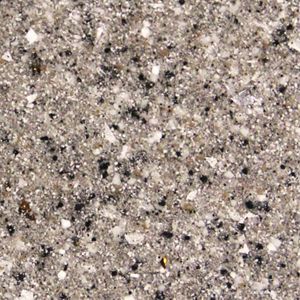 A close up of a gray and black granite counter top.