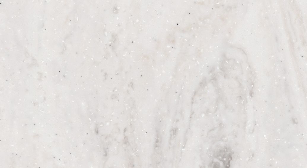 A close up of a white marble counter top.