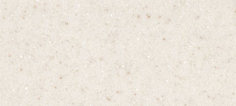 A close up of a white surface with small dots on it.