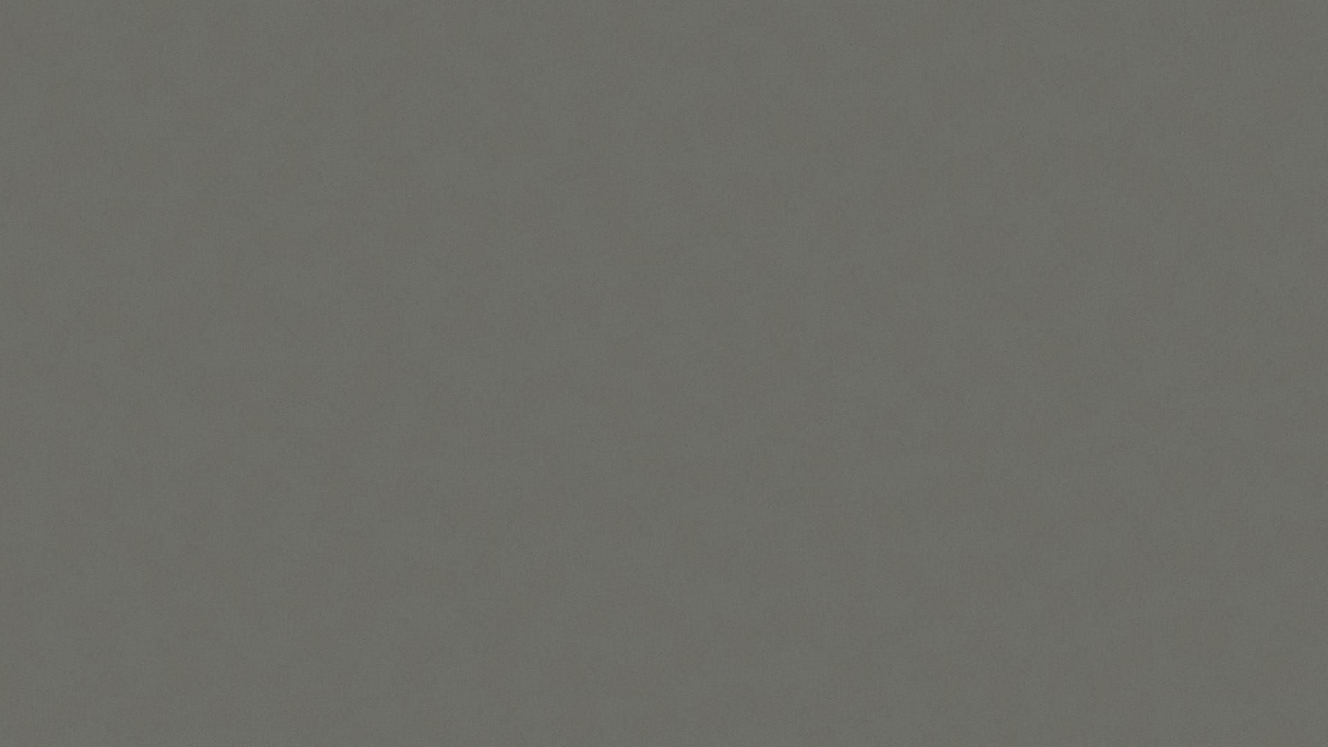 A close up of a gray background with a plain texture.