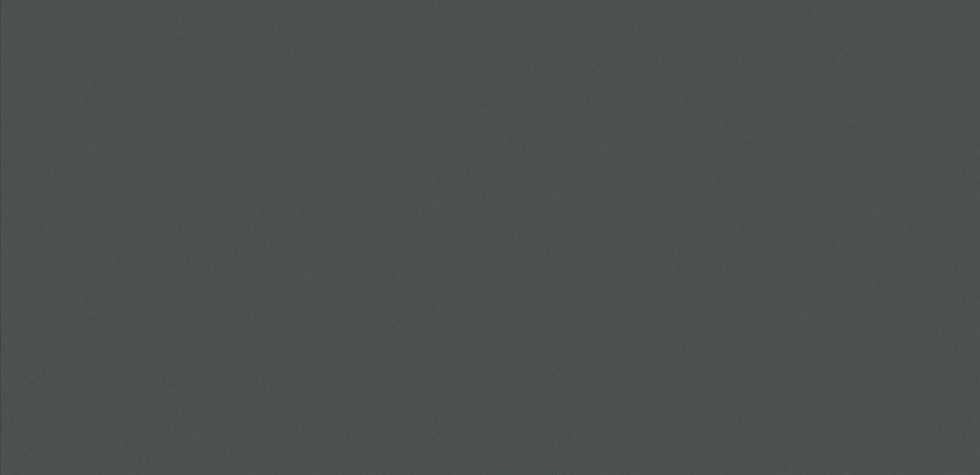 A close up of a gray background with a plain texture.