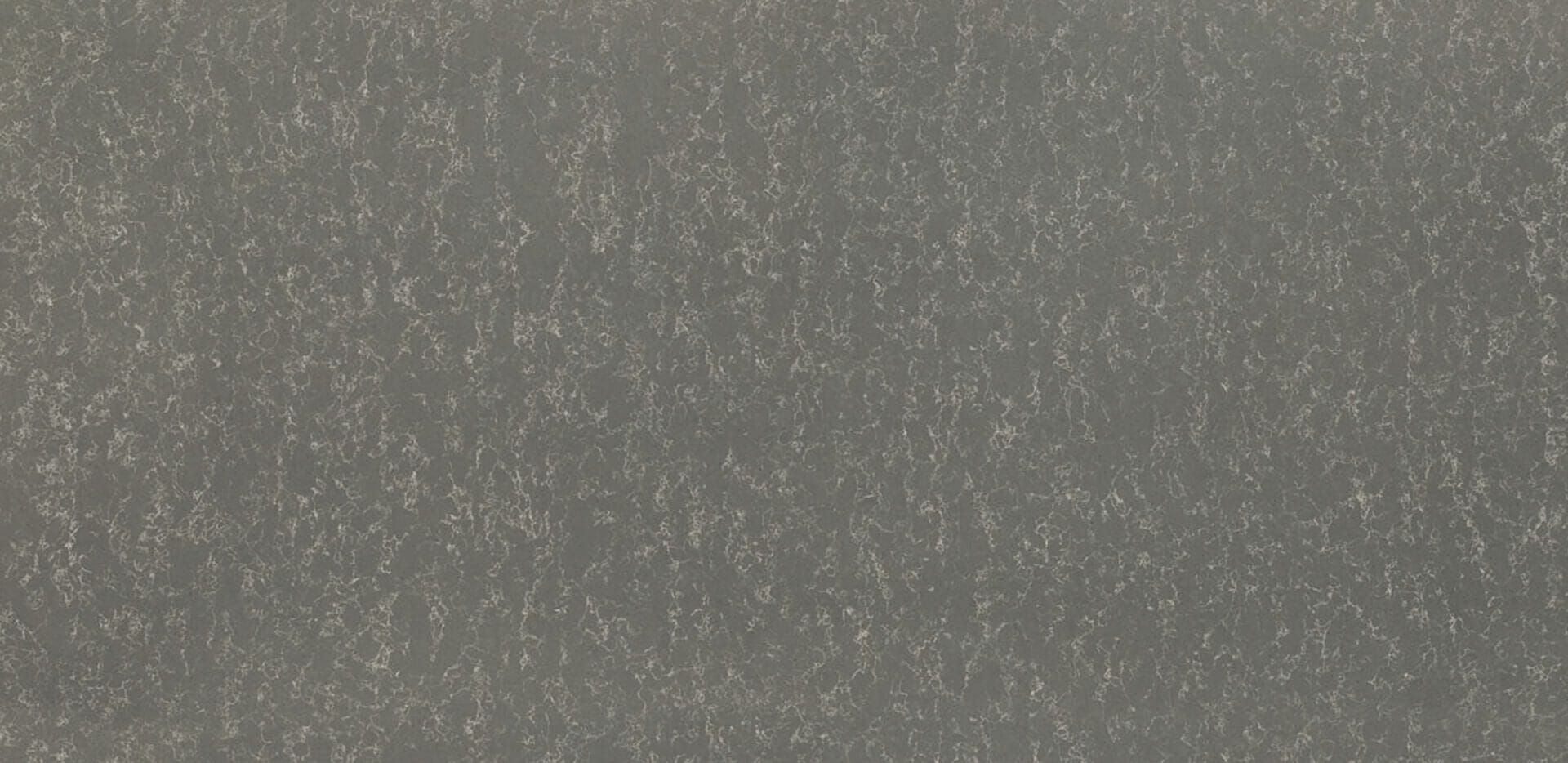 A close up of a gray surface with a grainy texture.