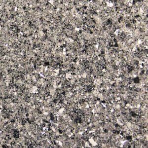 A close up of a gray and black granite counter top.